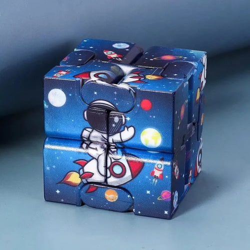 Infinity Magic Cube featuring a space-themed design with an astronaut riding a rocket against a deep blue galaxy background with planets and stars, showcasing the cube's folding segments and smooth surfaces.