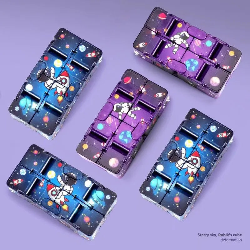 Infinity Magic Cube featuring space-themed patterns in blue and purple designs displayed on purple background, showing multiple cubes with astronaut and galaxy motifs demonstrating various folding positions and configurations