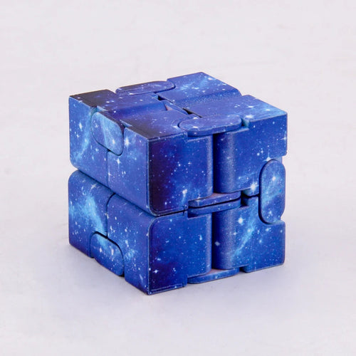 Infinity Magic Cube featuring a mesmerizing galaxy pattern in deep blue with starry design, displayed in its folded cube form against a light background, showcasing its interlocking segments and transformative structure.